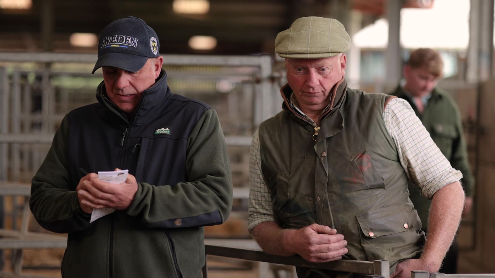 Buyers checking the sale catalogue at the mart