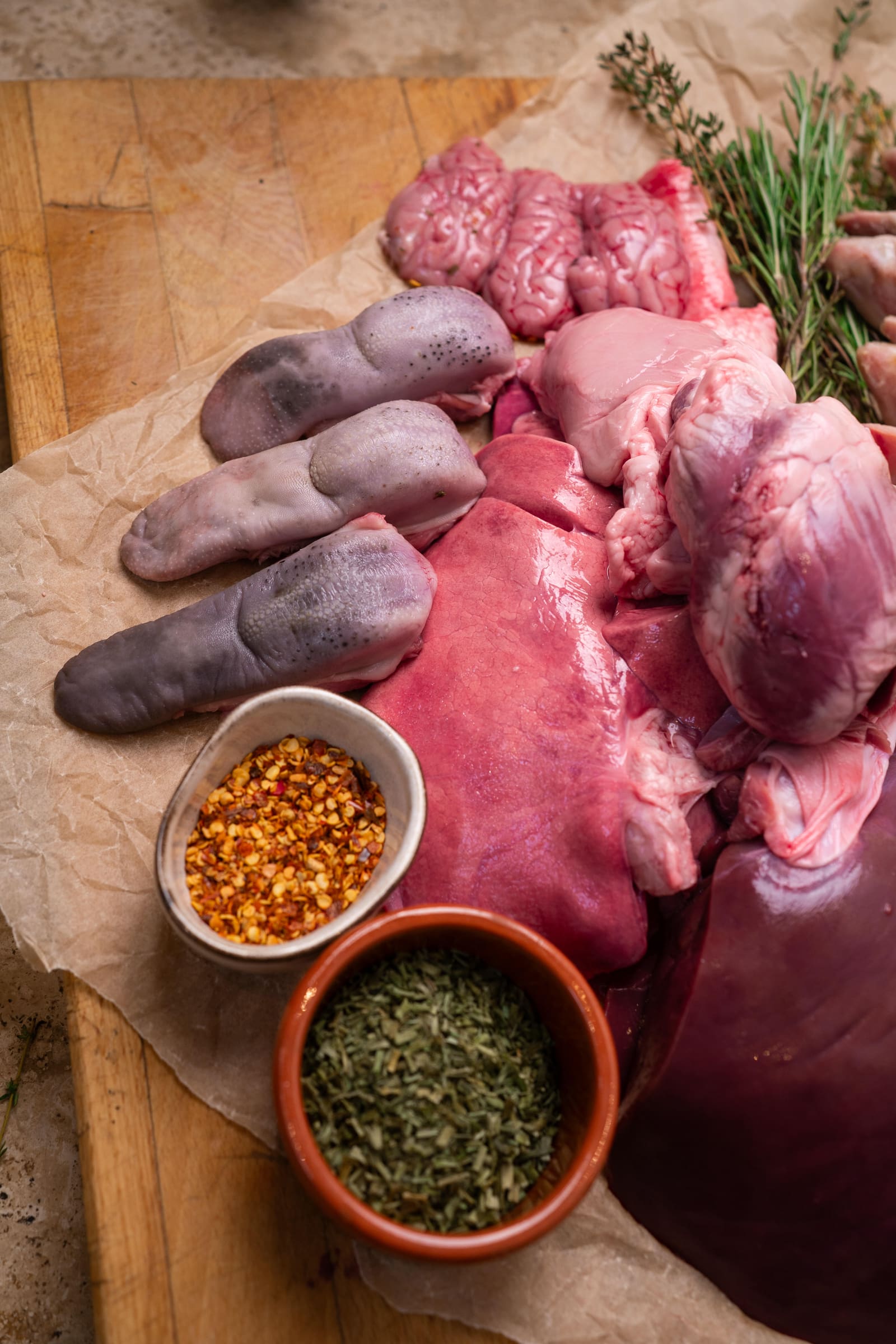 The offal range laid out: hearts, liver, tongues, trotters, brains and tripe