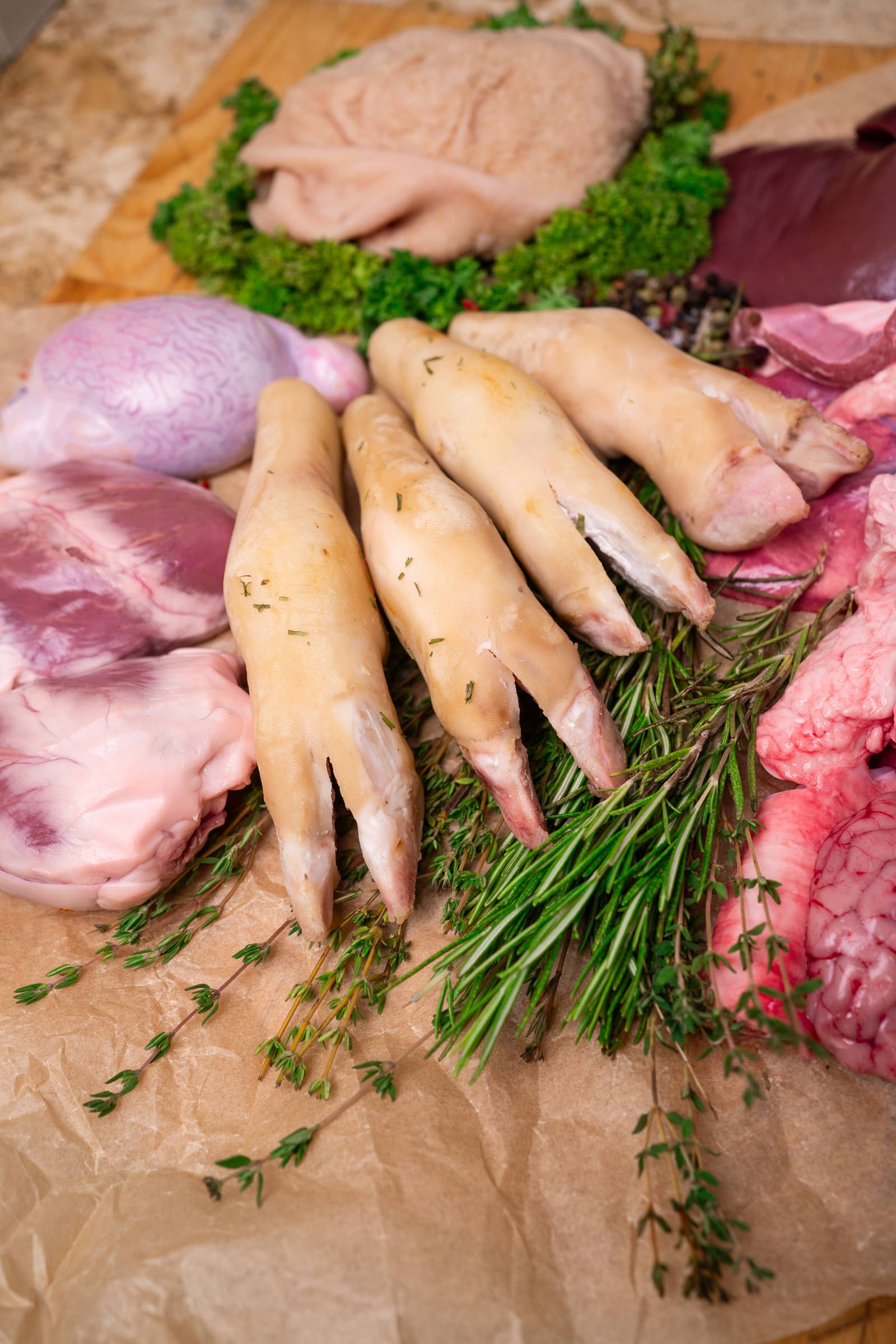 The offal range laid out: hearts, liver, tongues, trotters, brains and tripe